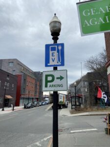 A road sign to electric vehicle parking in downtown White River Junction, VT